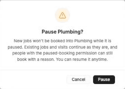 FieldCamp Pause Plumbing confirmation explaining that new jobs won't be booked while paused and that existing jobs and visits continue